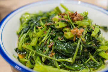 Fry morning glory with garlic dishes in restaurant