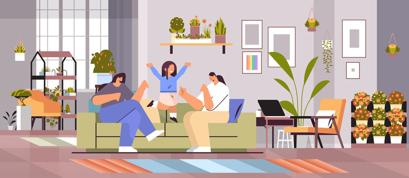 female parents playing with little child lesbian family transgender love LGBT community concept