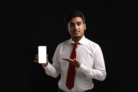 Young Indian Officer Or Student Showing Smartphone Screen