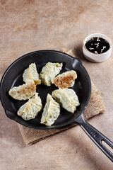 Gyoza is Japanese dumplings with chicken and vegetables.