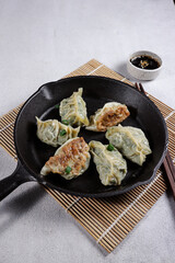 Gyoza is Japanese dumplings with chicken and vegetables.