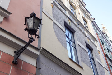 Tallinn, Estonia, Europe - 26 Nov 2021: Close up, selective focus of old-style black street lamp...