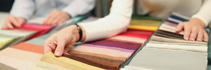 Buyer and seller choose color of fabric closeup