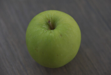 Granny Smith apples are small to medium fruits and range in shape from round, oval, to conical. The skin is smooth, firm, chewy, and thick, remaining bright green when ripe and covered in tiny.