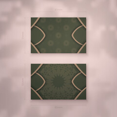 A presentable business card in green with vintage brown ornaments for your personality.
