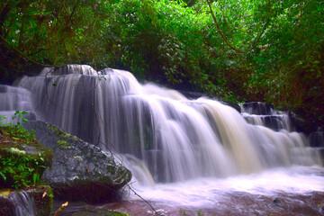 Fototapeta premium The waterfall is in the national park area of Thailand.