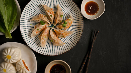 Steamed pork Chinese dumplings, meat and vegetables buns.