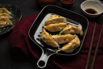 Yummy original steamed Chinese pork dumplings on a pan.
