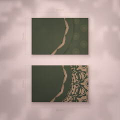 Business card in green color with a mandala pattern in brown for your contacts.
