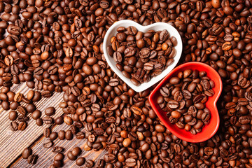 Horizontal background heart and coffee beans on a wooden table. Good morning coffee lover.