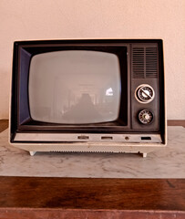 Retro old TV on wooden table 