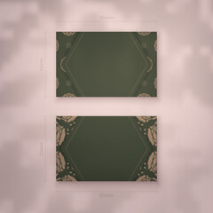 Business card in green with Indian brown pattern for your personality.