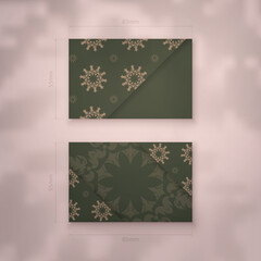 Business card in green with luxurious brown ornaments for your brand.