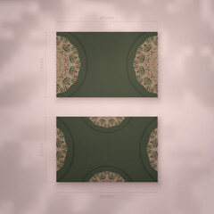 Business card in green with vintage brown ornaments for your personality.