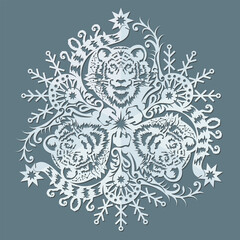 Paper snowflake with a depiction of a wild tiger.  New year decoration