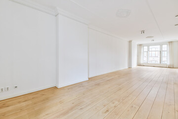 Long wide large light room with doors at the beginning
