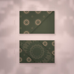 Business card template in green color with vintage brown ornament for your brand.