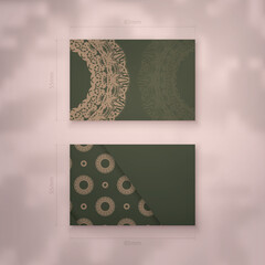 Business card template in green with an abstract brown pattern for your business.