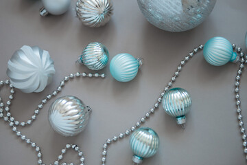 New year and Christmas tree decorations on grey background