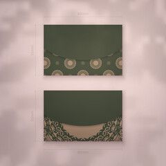 Business card template in green with luxurious brown ornaments for your brand.