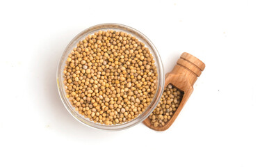 a bowl of mustard seeds on a white background