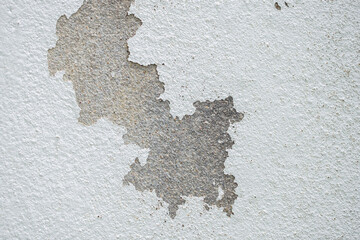 Abstract old white concrete wall with peeling paint