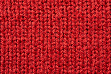 Fototapeta na wymiar Red knitted cloth wool texture surface background