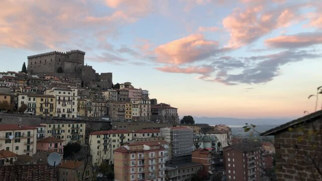Ancient Italian town Soriano del Cimino with Orsini castle at the top during sunset