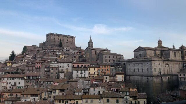 Ancient Italian town Soriano del Cimino with Orsini castle at the top during the day