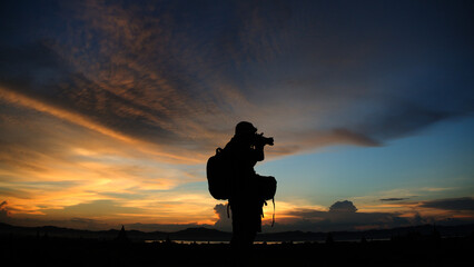 Fototapeta premium silhouette of a person with a camera
