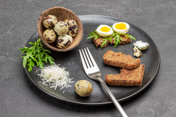 Toast with greens and boiled quail eggs.