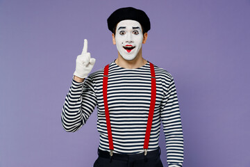 Insighted smart proactive fun young mime man with white face mask wear striped shirt beret holding...