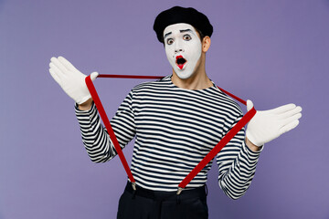 Charismatic amazing amusing crazy dizzy young mime man with white face mask wears striped shirt...