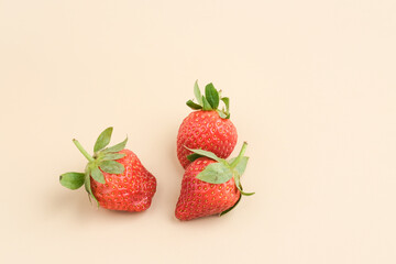 Strawberry, fresh juicy strawberries with leaves. Close up and selective focus.
