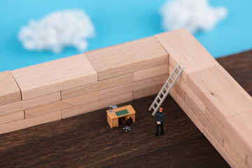 Miniature creative work is constrained by high walls