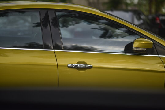 Close Up Of Yellow Car Door Handle