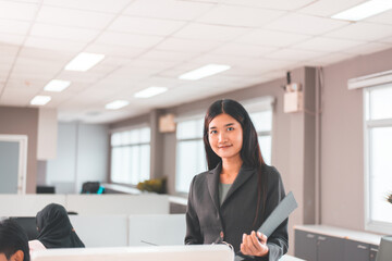 Young asian woman working in the workplace,Beautiful women with smiling face