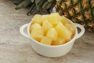 Marinated pineapple slices in the bowl