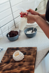 woman cooks delicious sweet desserts cakes in the kitchen