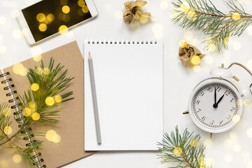 Back to life, goal list concept. Empty notebook with pencil, clock, phone. Resolutions, plan, goals, checklist, idea concept. Top view, flat lay, copy space. 2022. Christmas, New Year