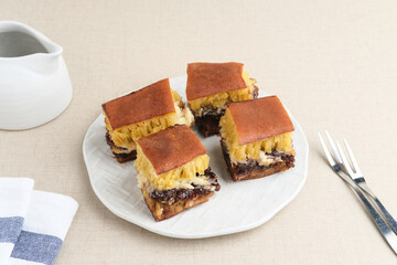 Martabak Manis or Kue Terang Bulan or Hok Lo Pan with various fillings is snack from Indonesia usually consumed at night. Served in white plate, selective focus image.
