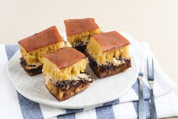 Martabak Manis or Kue Terang Bulan or Hok Lo Pan with various fillings is snack from Indonesia usually consumed at night. Served in white plate, selective focus image.
