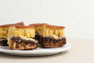 Martabak Manis or Kue Terang Bulan or Hok Lo Pan with various fillings is snack from Indonesia usually consumed at night. Served in white plate, selective focus image.

