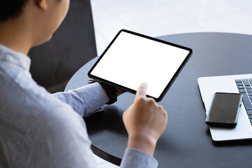 A man holding a tablet with a blank white screen. The blank space on the white screen can be used to write a message or place an image.