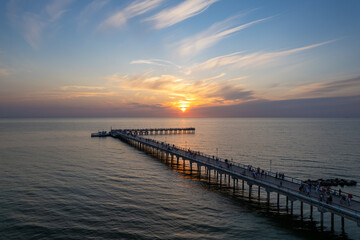 Aerial summer sunset view of sunny resort Palanga, Lithuania. Baltic sea, Palanga Bridge - Pier