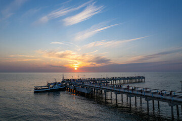 Aerial summer sunset view of sunny resort Palanga, Lithuania. Baltic sea, Palanga Bridge - Pier