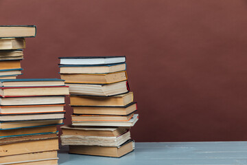 lots of books to study in the university library on a brown background