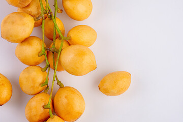 Thai fruit. Fresh ripe mafai with sweet and sour on white background.Close-up