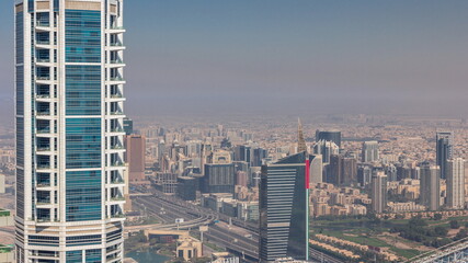 Fototapeta na wymiar Dubai Aerial view showing al barsha heights and greens district area timelapse
