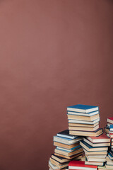 lots of books to study in the university library on a brown background